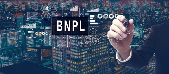 BNPL - Buy Now Pay Later theme with businessman in a city at night