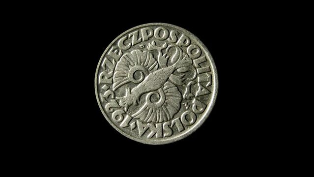 Reverse of old Poland coin 50 groszy 1923 with inscription meaning POLISH REPUBLIC, isolated in black background. 4k video.