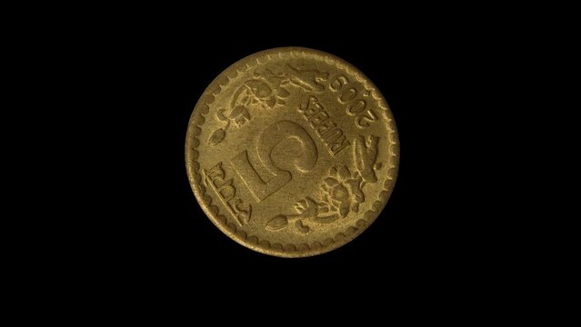 Rotating reverse of India coin 5 rupees 2009 with inscription meaning 5 RUPEES, isolated in black background. 4k video.