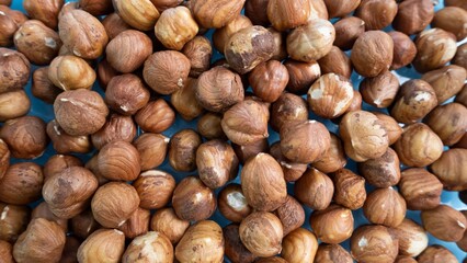 Hazelnut background. Many nuts. Hazelnut without shell 