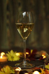 glass of white wine with autumn decoration