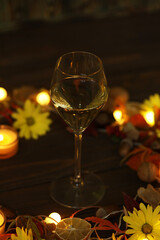 glass of white wine with autumn decoration