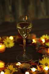 glass of white wine with autumn decoration