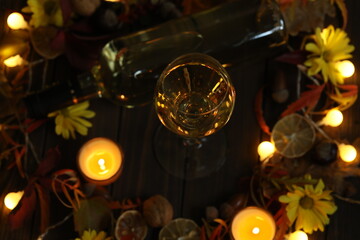 glass of white wine with autumn decoration