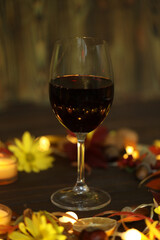 glass of red wine with autumn decoration