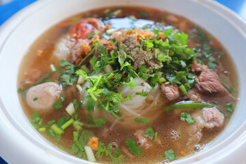 Pho (Vietnamese Noodle Soup) with beef and vegetables