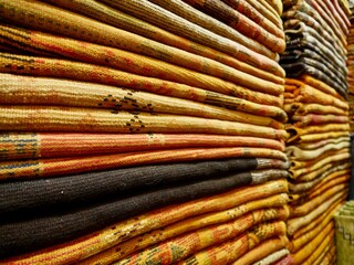 Pile of colorful Berber Carpets in Marrakech, Morocco.