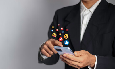 Man using smartphone with social media Social media and digital online concept The concept of living on vacation and playing social media. social distancing work from home 