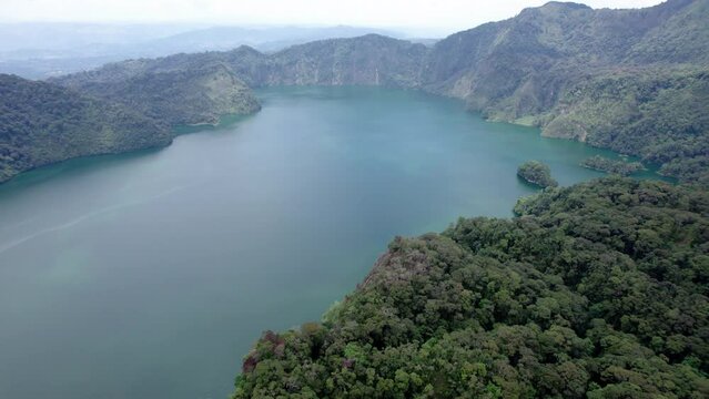 Ngozi lake in Mbeya, Tanzania. Drone view to second largest crater lake in Africa. Beautiful landscape surrounded by a bowl of high mountains.