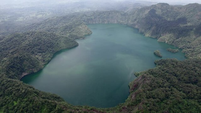 Ngozi lake in Mbeya, Tanzania. Drone view to second largest crater lake in Africa. Beautiful landscape surrounded by a bowl of high mountains.