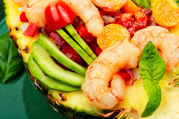 Pineapple stuffed with shrimp, rice and avocado.