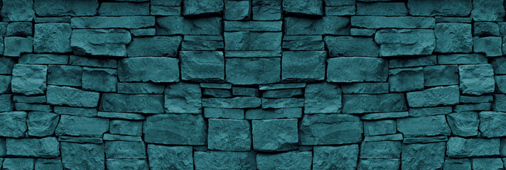 Natural stone wall teal color wide texture. Dark turquoise rough rock masonry widescreen textured...