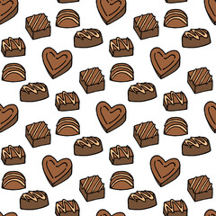 Seamless pattern with chocolates on a white background. Vector image.