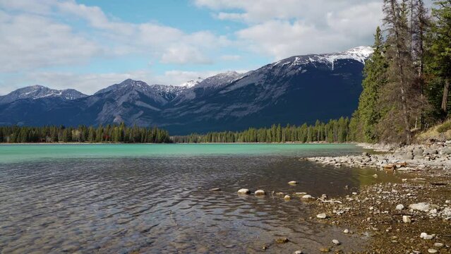 Lake Annette lake shore beach, Jasper National Park stunning nature scenery in summer time. Landscape of Canadian Rockies, Alberta, Canada.