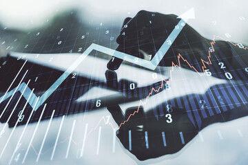 Abstract creative financial graph with upward arrow and finger clicks on a digital tablet on background, financial and trading concept. Multiexposure