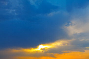 Naklejka na ściany i meble Morning sky with glowing light and clouds