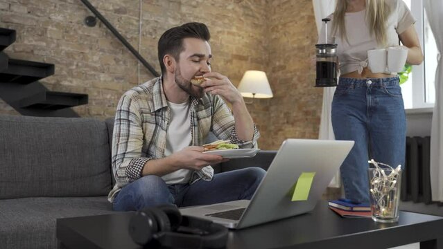 Couple having video call during their lunch break on laptop