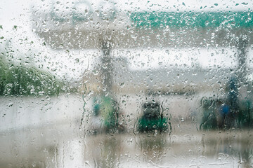 Rain droplets on window with out of focus background