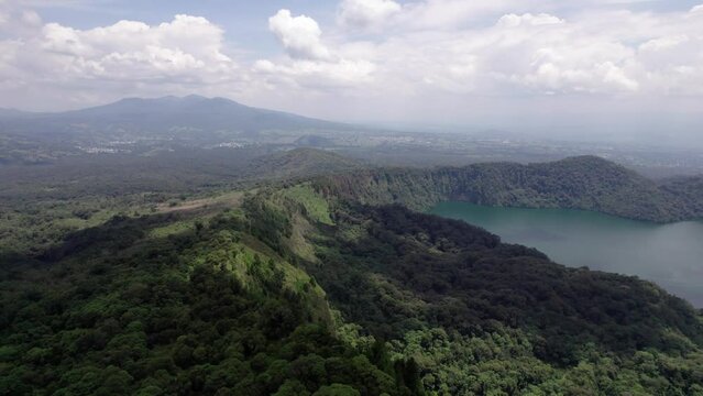 Ngozi lake in Mbeya, Tanzania. Drone view to second largest crater lake in Africa. Beautiful landscape surrounded by a bowl of high mountains.