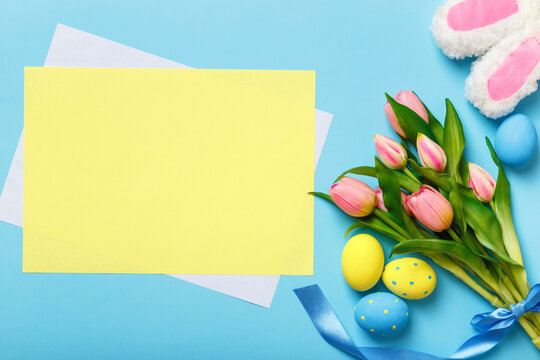 Easter card. Bouquet of tulips eggs rabbit ears. Empty sheet of paper with space for text and copy space
