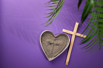 Ash Wednesday, Lent Season and Holy Week concept. Christian crosses and ashes on purple background.