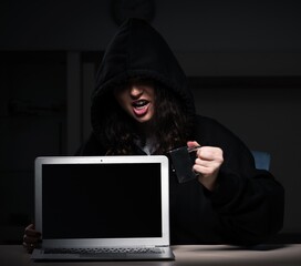 Female hacker hacking security firewall late in office