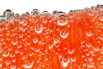 Grapefruit slice peeled pulpy capsules in water with air bubbles, in background light, close-up isolated, white, background, clipping, path