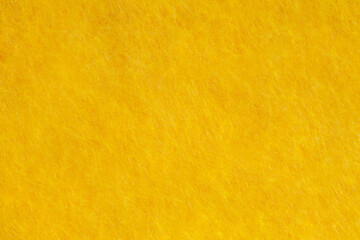 Fabric is fleece yellow, background wallpaper, uniform texture pattern