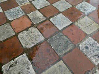 Red and white stone floor tiles. Budva, Montenegro. 