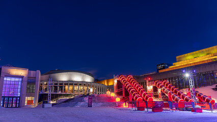 the Montreal en lumière festival attracts tourists to the Cartier Des Spectacles who can skate on the high skating rink and slide down the steps of Place Des Arts