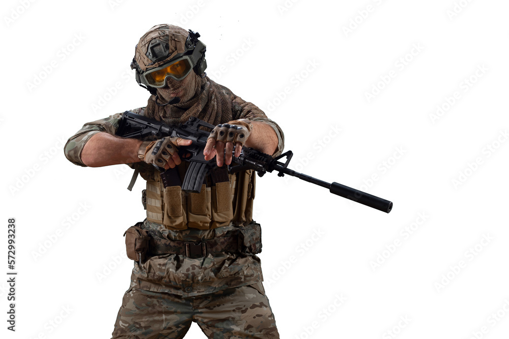 Wall mural Special Mercenary soldie during a special operation walks with an automatic rifle and looking at camera.