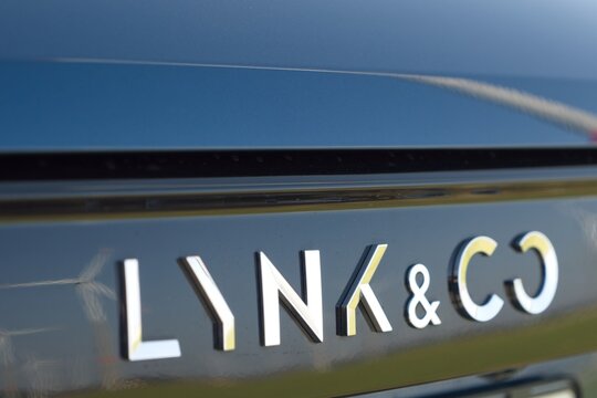 Lynk Co. emblems on the back of a dark electric car 