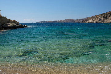 The beautiful turquoise sandy beach of Sapounohoma in Ios Greece
