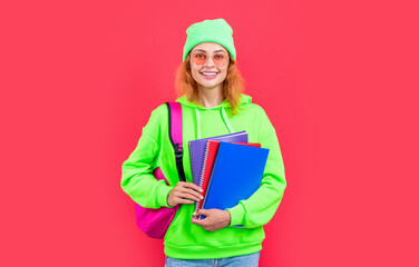 school education of cheerful girl student. school girl student isolated on red background.