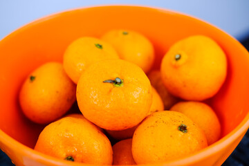 bowl of oranges, tangerine or mandarin orange