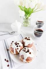 Donuts and black coffee on a white background. breakfast