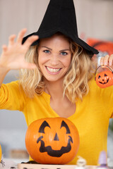 woman at home showing halloween decorations