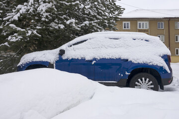 City of Liptovský Hrádok, Slovakia - February 4.2023 : The storm covered cars, roads and houses in northern Slovakia with snow.