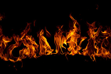 Flame fires. Burn lights on a black background. Fire flames on black background. Abstract fire...