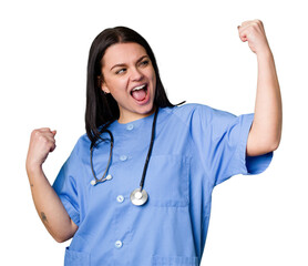 Young nurse woman isolated raising fist after a victory, winner concept.