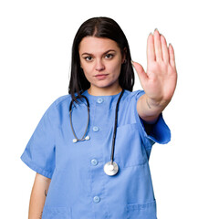 Young nurse woman isolated standing with outstretched hand showing stop sign, preventing you.