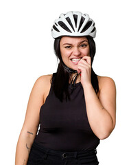 Young caucasian woman wearing a helemet isolated biting fingernails, nervous and very anxious.