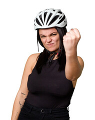 Young caucasian woman wearing a helemet isolated showing fist to camera, aggressive facial expression.