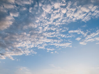 Fototapeta na wymiar Blue sky with fluffy clouds and sunlight
