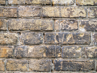 Wall of the old church. Background from brown bricks. Stone pattern.  Old brick laying