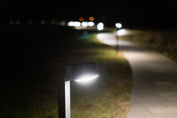 Curvy walk path at night illuminated with a lights in Denmark Europe