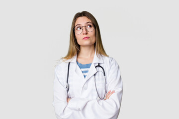 Young female doctor confidently gazing at the camera.