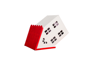 Small toy house isolated on white background