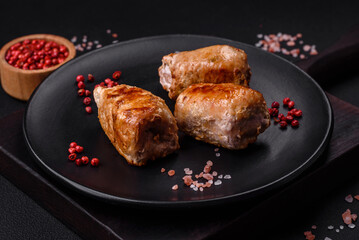Delicious chicken or pork meat roll with mushrooms, cheese, spices and herbs