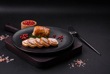 Delicious chicken or pork meat roll with mushrooms, cheese, spices and herbs